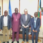 Archbishop Elias Taban Center and late Fink-File Photo
