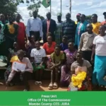 Women pose for a group photo after the meeting-Credit -Morobo County Press Unit