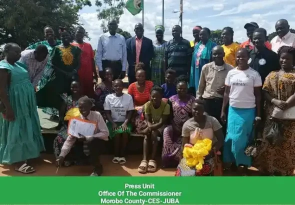 Women pose for a group photo after the meeting-Credit -Morobo County Press Unit