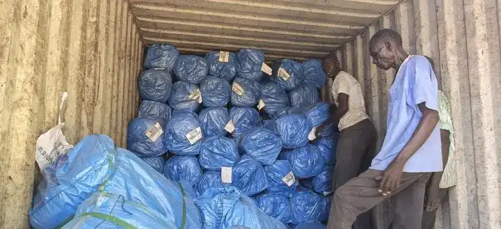Mosquito nets being unloaded from a truck. Photo credit: James Innocent