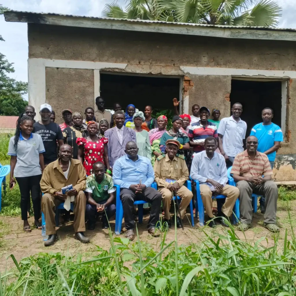 Participants pose for a group photo after the training