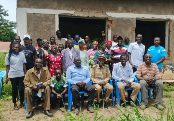 Participants pose for a group photo after the training