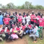 Arsenal Football supporters pose for a group photo. Credit: Vita Henry