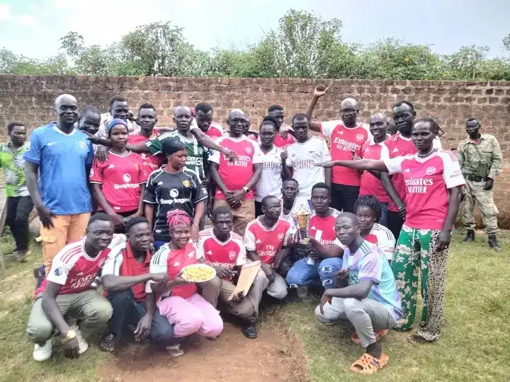 Arsenal Football supporters pose for a group photo. Credit: Vita Henry