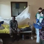 Medical workers attend to a suspect patient at Yei civil hospital. Photo Credit: James Innocent / Access Radio