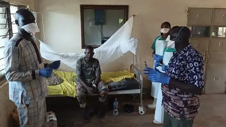 Medical workers attend to a suspect patient at Yei civil hospital. Photo Credit: James Innocent / Access Radio