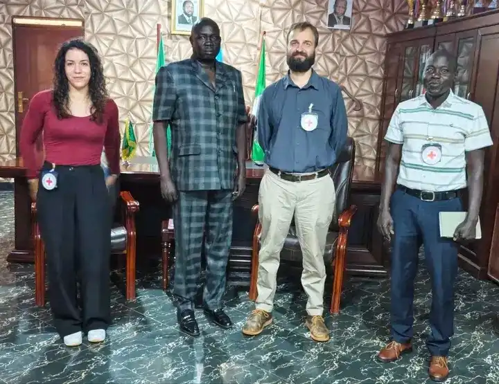 Yei commissioner and ICRC officials Pose for a group photo at the county head quarters. Photo Credit: James Innocent