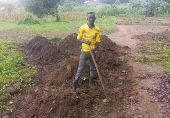 Kissenga Henry in his Farm land