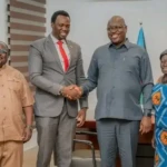 Governor Adil shakes hand with the national chaiperosn of HIV Commission