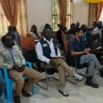 Humanitarian and Government officials in a joint partners meeting