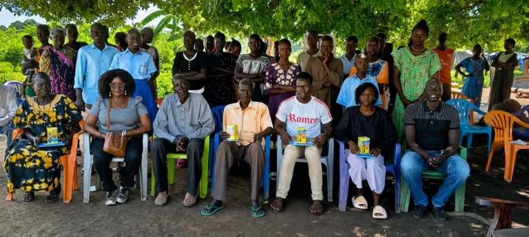 Leaders of the Community Engagament Groups siting infront joined by Women Foundation for Humanity officials for a group photo