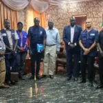 UN and County officials pose for a group photo inside the office of Yei County Commissioner. Photo Credit-James Innocent
