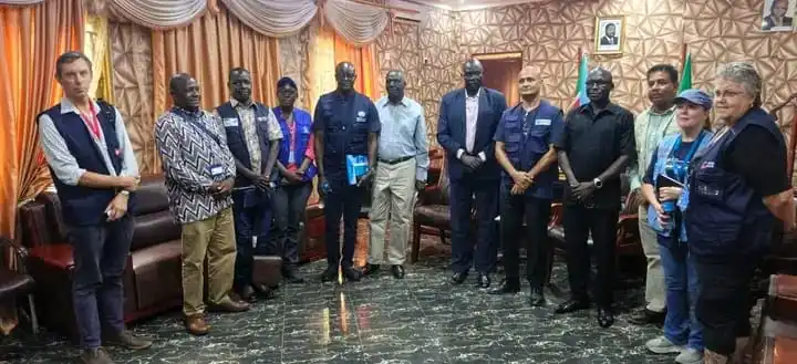 UN and County officials pose for a group photo inside the office of Yei County Commissioner. Photo Credit-James Innocent