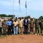 Yei commissioner Center with UNMISS officials in a group photo