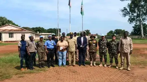 Yei commissioner Center with UNMISS officials in a group photo