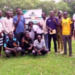 Youth pose for a photo after completing the entreprenuership bootcamp in Yei River County