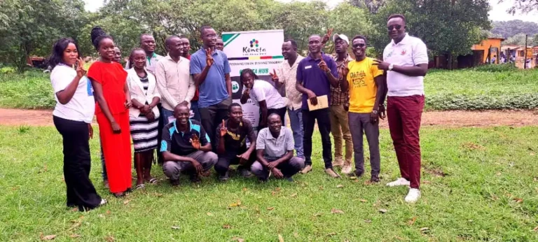 Youth pose for a photo after completing the entreprenuership bootcamp in Yei River County