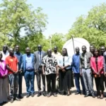 Media Stakeholders pose for a group photo after the meeting. Photo Credit-AMDISS