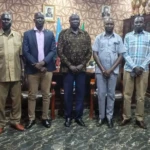 Official meeting the county commisoner in his office