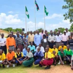 School pupils and Education officials pose for a group photo at the county headquarters-Photo Credit-Emmanuel Malish Richard