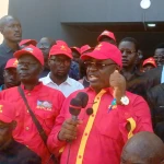 Emmanuel Adil Anthony adressing supporters at the SPLM Secretariat