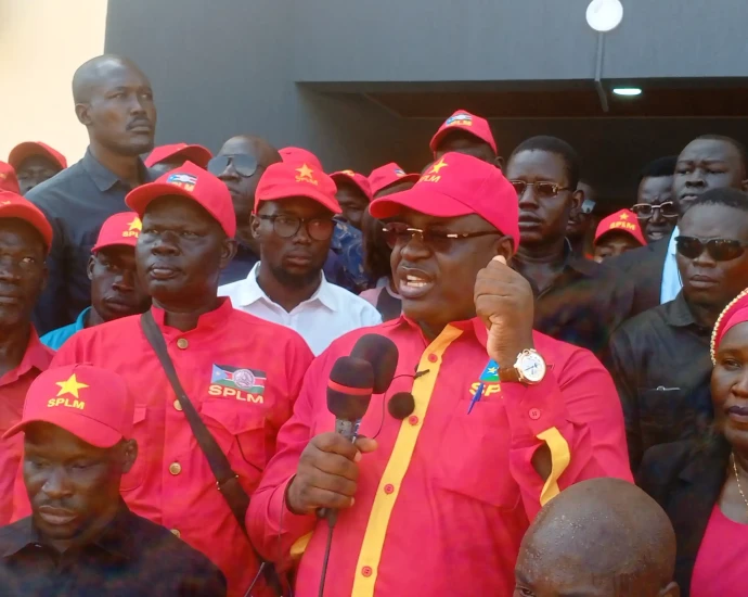 Emmanuel Adil Anthony adressing supporters at the SPLM Secretariat