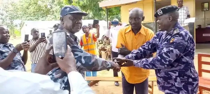 Kajo-Keji Chief in Orange Shirt handed over by Uganda Police