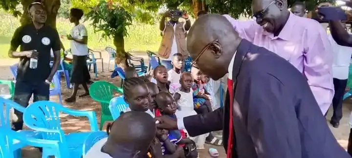 Kajo-Keji Commisisoner administering Polio vaccine to children in Kajo-Keji
