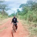 Mapoko resident rides his bike into Yei town. PHOTO CREDIT-Christopher Taharir