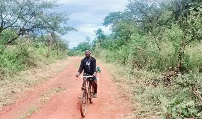 Mapoko resident rides his bike into Yei town. PHOTO CREDIT-Christopher Taharir