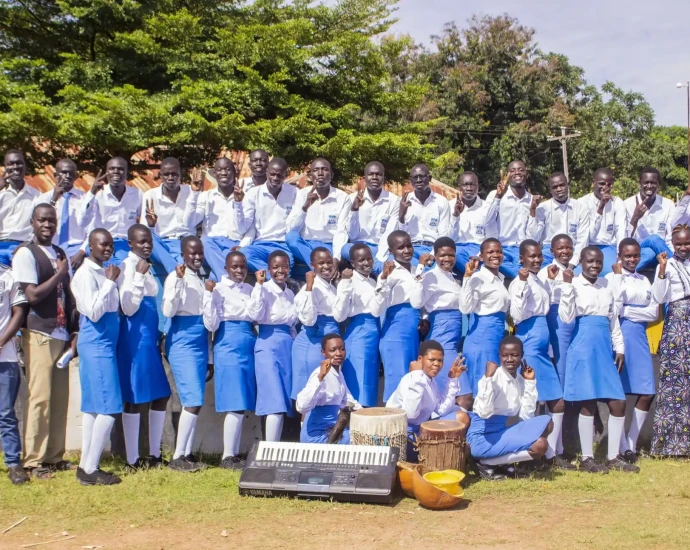 Students of Midland secondary school post for a group photo at the event. Photo Credit-TIDE